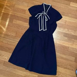 J. Crew P4 navy blue dress with bow-neck and white trim. Knee length.